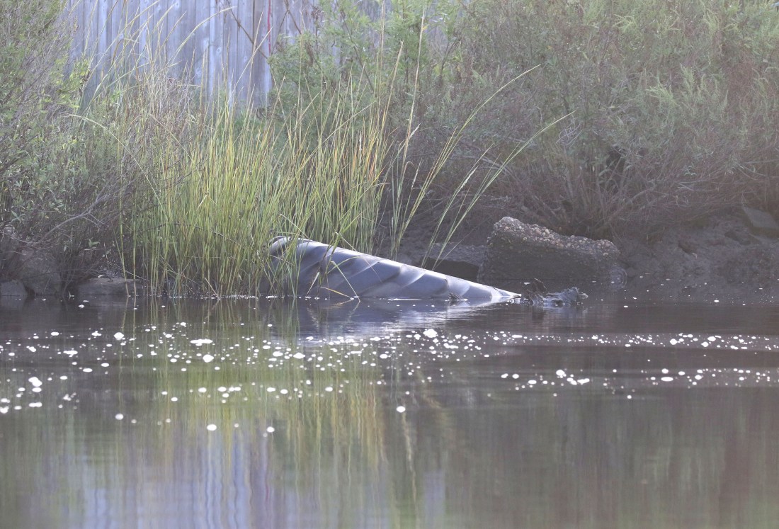 Heavy equipment tire and aggregate concrete in the river