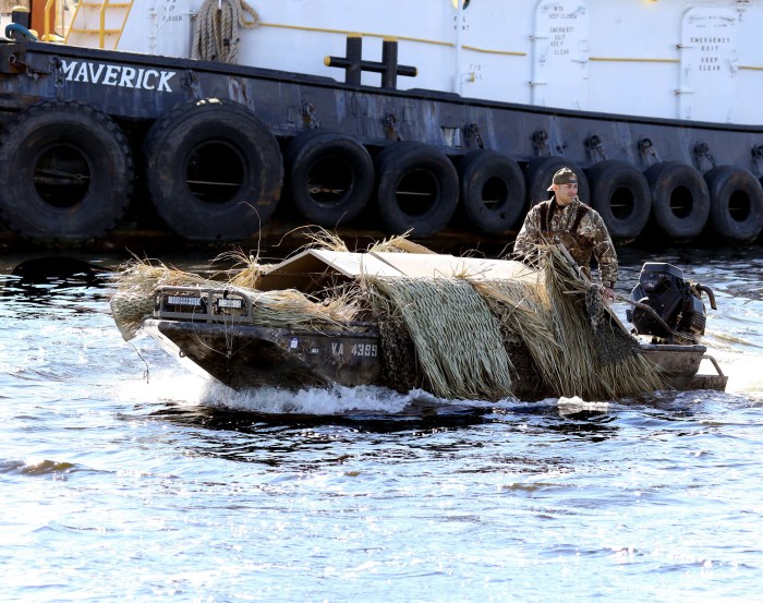 A hunter returns to a dock